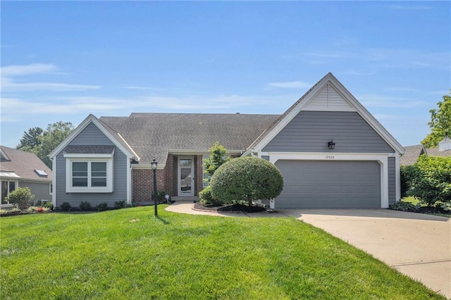 12428 Cambridge Cir, Leawood, KS 66209 - view of front of property featuring an attached garage, a front lawn, and driveway