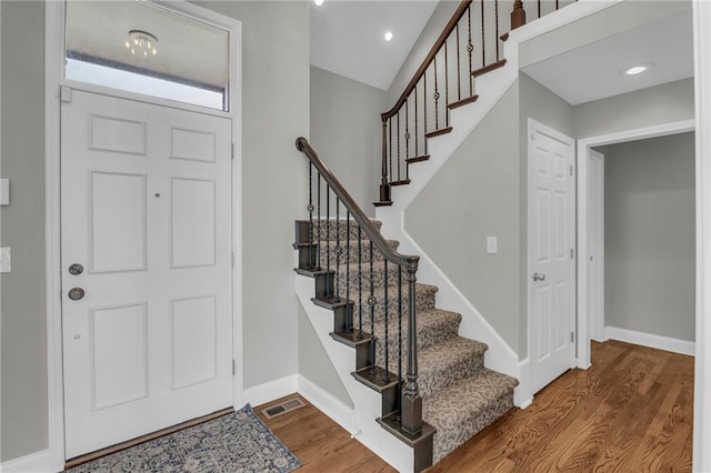 12428 Cambridge Cir, Leawood, KS 66209 - entrance foyer featuring wood finished floors, baseboards, stairs, and recessed lighting
