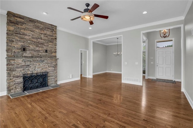 12428 Cambridge Cir, Leawood, KS 66209 - unfurnished living room with a chandelier, a ceiling fan, wood finished floors, a fireplace, and crown molding