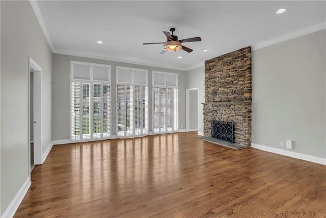 12428 Cambridge Cir, Leawood, KS 66209 - unfurnished living room featuring ornamental molding, ceiling fan, wood finished floors, a fireplace, and baseboards