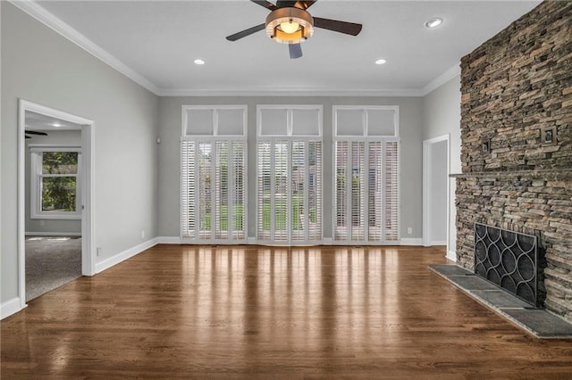 12428 Cambridge Cir, Leawood, KS 66209 - unfurnished living room with wood finished floors, ceiling fan, ornamental molding, a stone fireplace, and baseboards