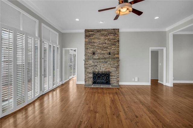 12428 Cambridge Cir, Leawood, KS 66209 - unfurnished living room with a ceiling fan, crown molding, a fireplace, wood finished floors, and recessed lighting