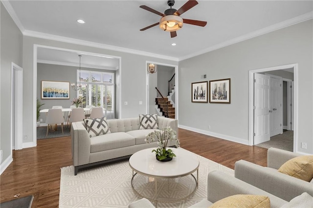 12428 Cambridge Cir, Leawood, KS 66209 - living room featuring wood finished floors, ceiling fan, stairway, baseboards, and crown molding