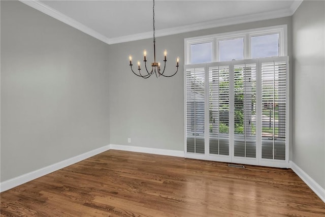 12428 Cambridge Cir, Leawood, KS 66209 - unfurnished dining area with a chandelier, baseboards, ornamental molding, and wood finished floors