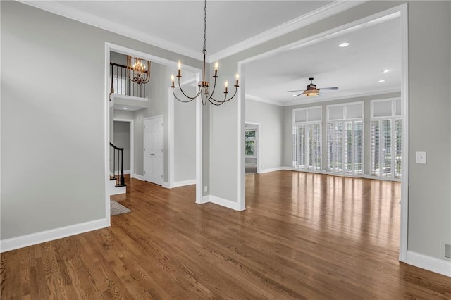 12428 Cambridge Cir, Leawood, KS 66209 - unfurnished dining area featuring ceiling fan, a chandelier, crown molding, wood finished floors, and stairway