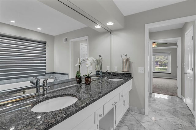 12428 Cambridge Cir, Leawood, KS 66209 - bathroom featuring baseboards, marble finish flooring, double vanity, and recessed lighting