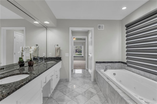 12428 Cambridge Cir, Leawood, KS 66209 - bathroom featuring marble finish flooring, double vanity, a jetted tub, baseboards, and recessed lighting