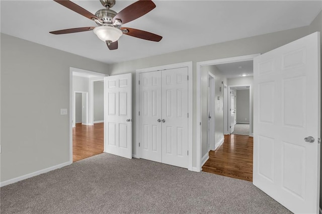 12428 Cambridge Cir, Leawood, KS 66209 - unfurnished bedroom featuring carpet, baseboards, a closet, and a ceiling fan