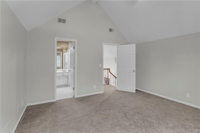 12428 Cambridge Cir, Leawood, KS 66209 - unfurnished bedroom featuring high vaulted ceiling, carpet, baseboards, and ensuite bath