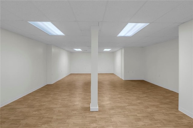 12428 Cambridge Cir, Leawood, KS 66209 - finished basement featuring light wood-type flooring, a drop ceiling, and baseboards