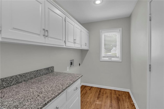 12428 Cambridge Cir, Leawood, KS 66209 - laundry area with cabinet space, hookup for a washing machine, baseboards, wood finished floors, and recessed lighting