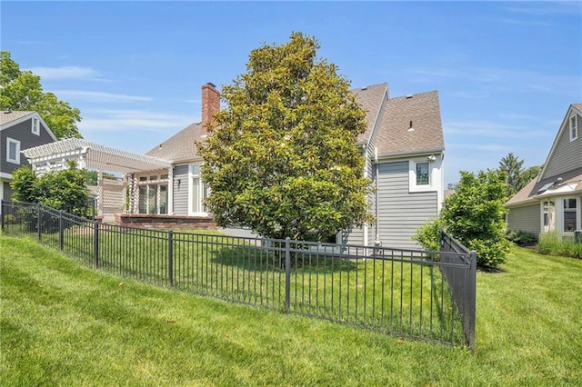 12428 Cambridge Cir, Leawood, KS 66209 - back of house with a pergola and roof with shingles