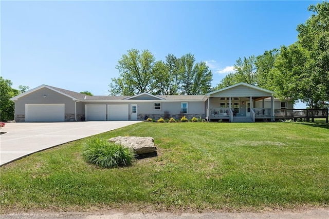 3906 Oo Hwy, Odessa, MO 64076 - view of front facade featuring driveway, an attached garage, a porch, and a front lawn