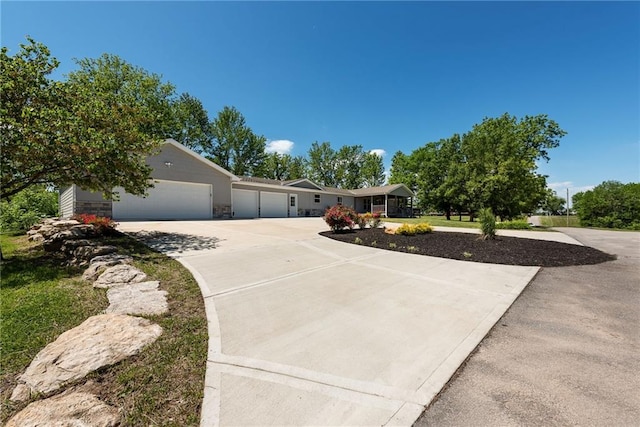 3906 Oo Hwy, Odessa, MO 64076 - ranch-style home with driveway, a garage, and stone siding