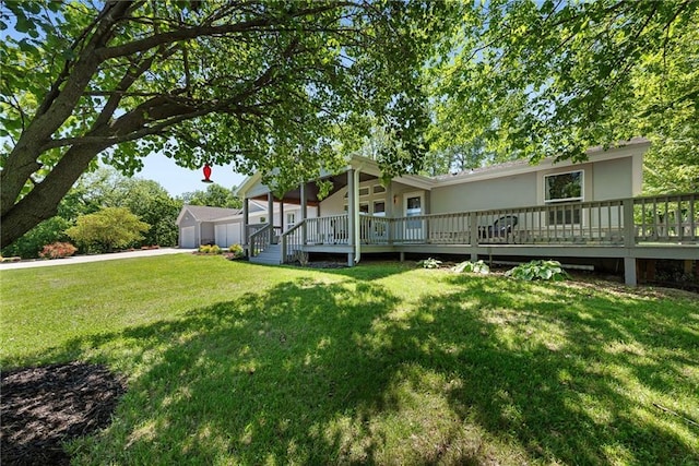 3906 Oo Hwy, Odessa, MO 64076 - view of grassy yard featuring a detached garage, an outbuilding, and a wooden deck