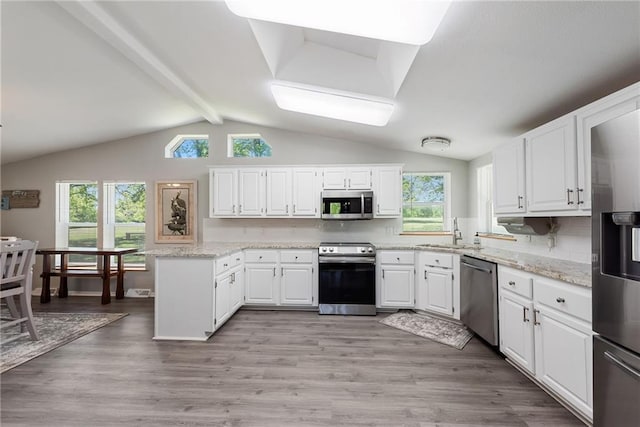3906 Oo Hwy, Odessa, MO 64076 - kitchen with stainless steel appliances, a peninsula, a sink, and healthy amount of natural light