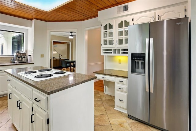 12844 Granada Ln, Leawood, KS 66209 - kitchen with stainless steel fridge with ice dispenser, white electric stovetop, wooden ceiling, light tile patterned flooring, and white cabinetry