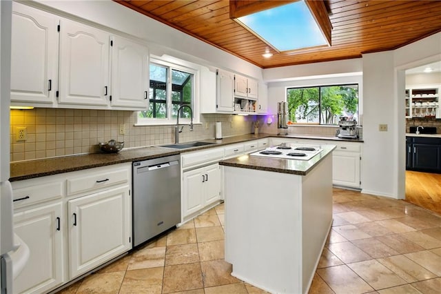 12844 Granada Ln, Leawood, KS 66209 - kitchen featuring dishwasher, wood ceiling, white electric cooktop, decorative backsplash, and white cabinetry