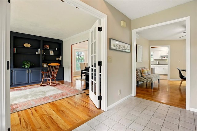 12844 Granada Ln, Leawood, KS 66209 - hallway featuring light wood-style flooring and baseboards