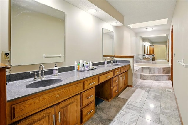 12844 Granada Ln, Leawood, KS 66209 - bathroom with double vanity, a garden tub, a skylight, and marble look tiles