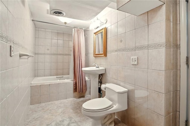 12844 Granada Ln, Leawood, KS 66209 - full bathroom with tile walls and tiled shower / bath combo