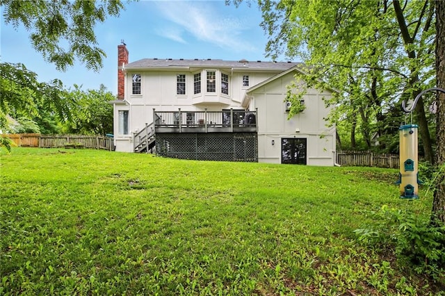 12844 Granada Ln, Leawood, KS 66209 - back of property with a deck, stairs, and a chimney