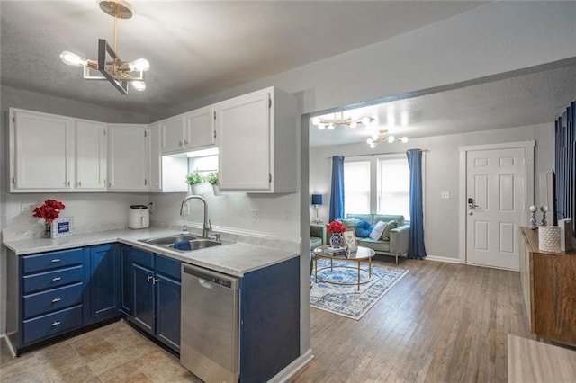 3802 Roanoke Rd, Kansas City, MO 64111 - kitchen featuring dishwasher, a chandelier, a sink, white cabinetry, and a textured ceiling