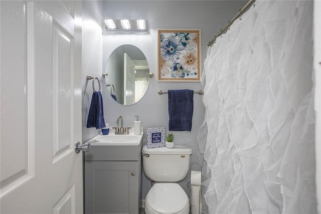 3802 Roanoke Rd, Kansas City, MO 64111 - bathroom featuring vanity, toilet, and a shower with shower curtain