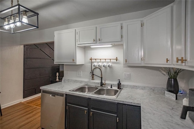 3802 Roanoke Rd, Kansas City, MO 64111 - kitchen with dishwasher, a sink, light countertops, and wood finished floors