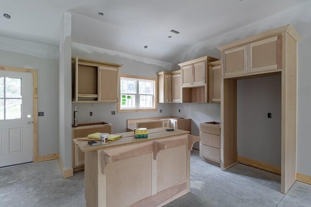 3000 Sheffield Ln, Saint Joseph, MO 64506 - kitchen with a center island, vaulted ceiling, and light brown cabinets
