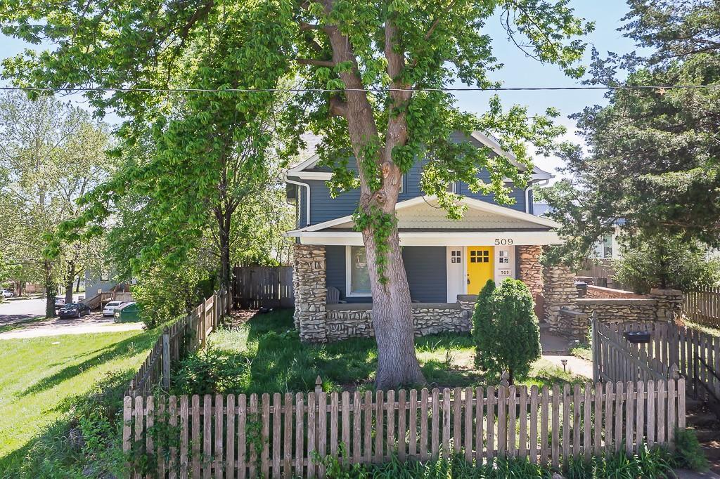 509 Pottawatomie St, Leavenworth, KS 66048 - view of front of home with stone siding and a porch