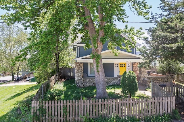 509 Pottawatomie St, Leavenworth, KS 66048 - view of front of home with stone siding and a porch