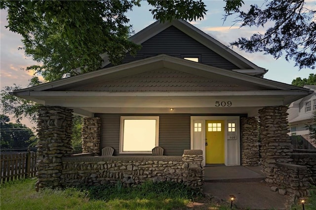 509 Pottawatomie St, Leavenworth, KS 66048 - view of front of house with covered porch and stone siding