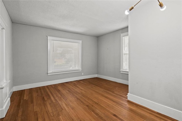 509 Pottawatomie St, Leavenworth, KS 66048 - empty room featuring wood finished floors and a textured ceiling
