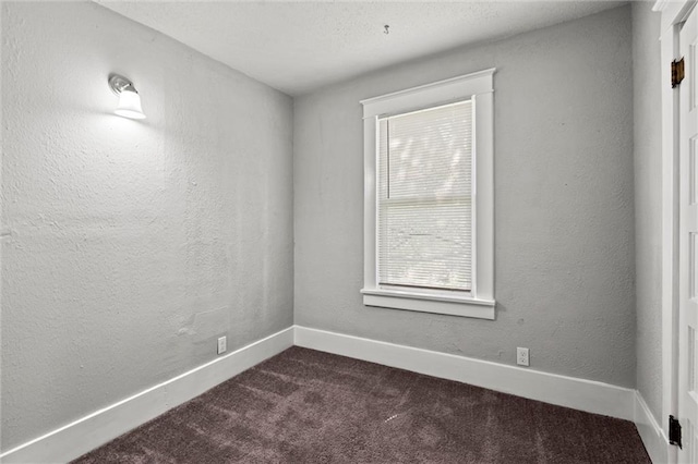 509 Pottawatomie St, Leavenworth, KS 66048 - spare room featuring dark carpet and baseboards