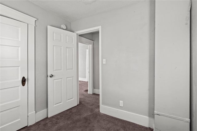 509 Pottawatomie St, Leavenworth, KS 66048 - unfurnished bedroom with dark colored carpet, a closet, and a textured ceiling