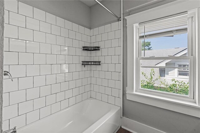 509 Pottawatomie St, Leavenworth, KS 66048 - bathroom with healthy amount of natural light and washtub / shower combination