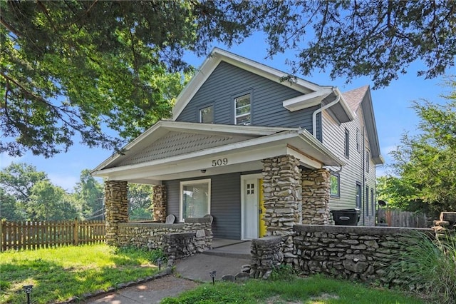509 Pottawatomie St, Leavenworth, KS 66048 - view of front of property featuring stone siding and covered porch