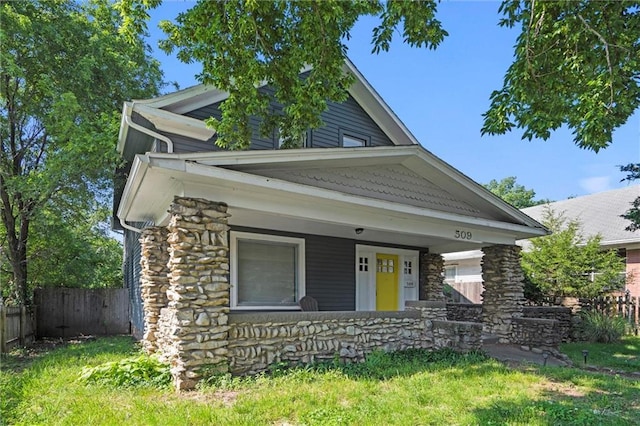 509 Pottawatomie St, Leavenworth, KS 66048 - view of front facade with stone siding and a porch