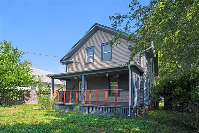 509 Pottawatomie St, Leavenworth, KS 66048 - view of front of home featuring a front lawn and covered porch