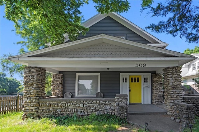 509 Pottawatomie St, Leavenworth, KS 66048 - view of front of property featuring covered porch and stone siding