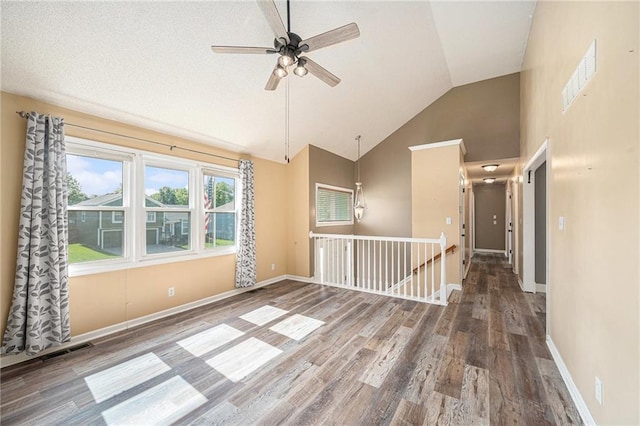 212 Hampton Dr, Smithville, MO 64089 - unfurnished room featuring ceiling fan, wood finished floors, and high vaulted ceiling