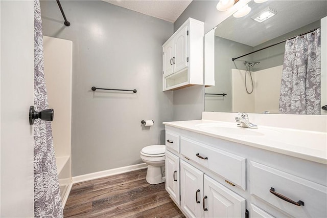212 Hampton Dr, Smithville, MO 64089 - bathroom featuring vanity, wood finished floors, and shower / bath combo