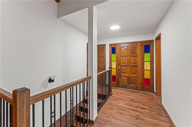 804 5th St, Baldwin City, KS 66006 - foyer with wood finished floors, baseboards, and recessed lighting