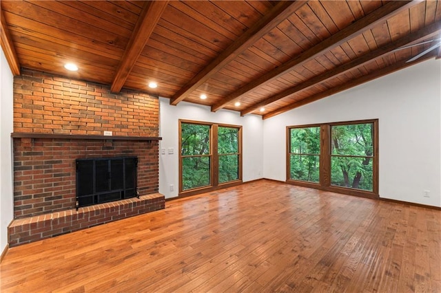 804 5th St, Baldwin City, KS 66006 - unfurnished living room featuring wood ceiling, hardwood / wood-style floors, a fireplace, and baseboards