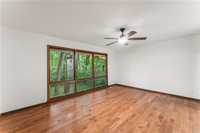 804 5th St, Baldwin City, KS 66006 - spare room featuring light wood-type flooring, ceiling fan, and baseboards