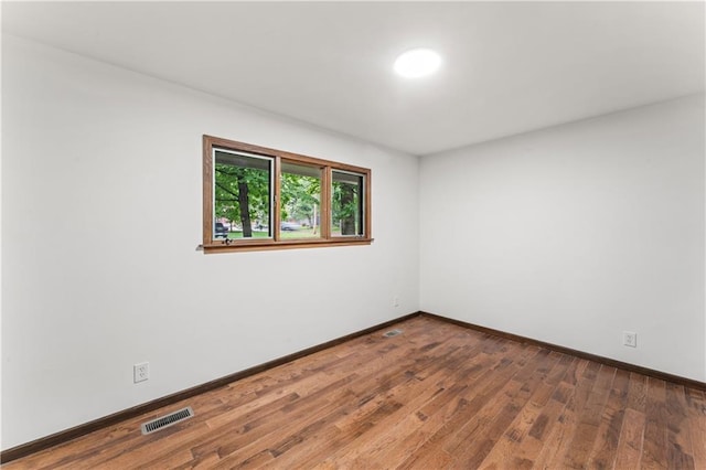 804 5th St, Baldwin City, KS 66006 - unfurnished room featuring wood finished floors and baseboards