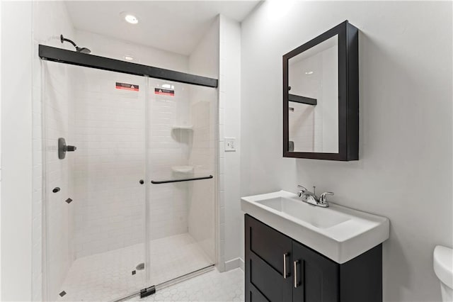 804 5th St, Baldwin City, KS 66006 - full bathroom featuring vanity, a stall shower, toilet, and recessed lighting