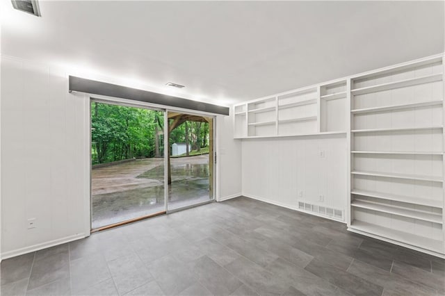 804 5th St, Baldwin City, KS 66006 - spare room with baseboards and built in shelves