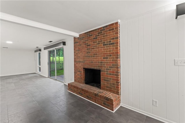 804 5th St, Baldwin City, KS 66006 - unfurnished living room with a fireplace and baseboards